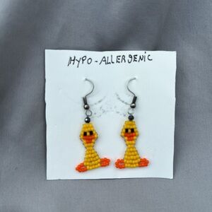 Adorable hand beaded yellow birdy earrings.